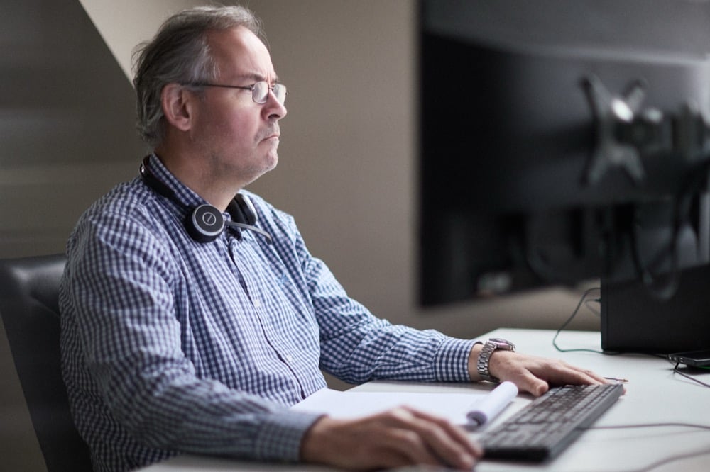 Darren Le Couvey at work in the Oracle Finance office