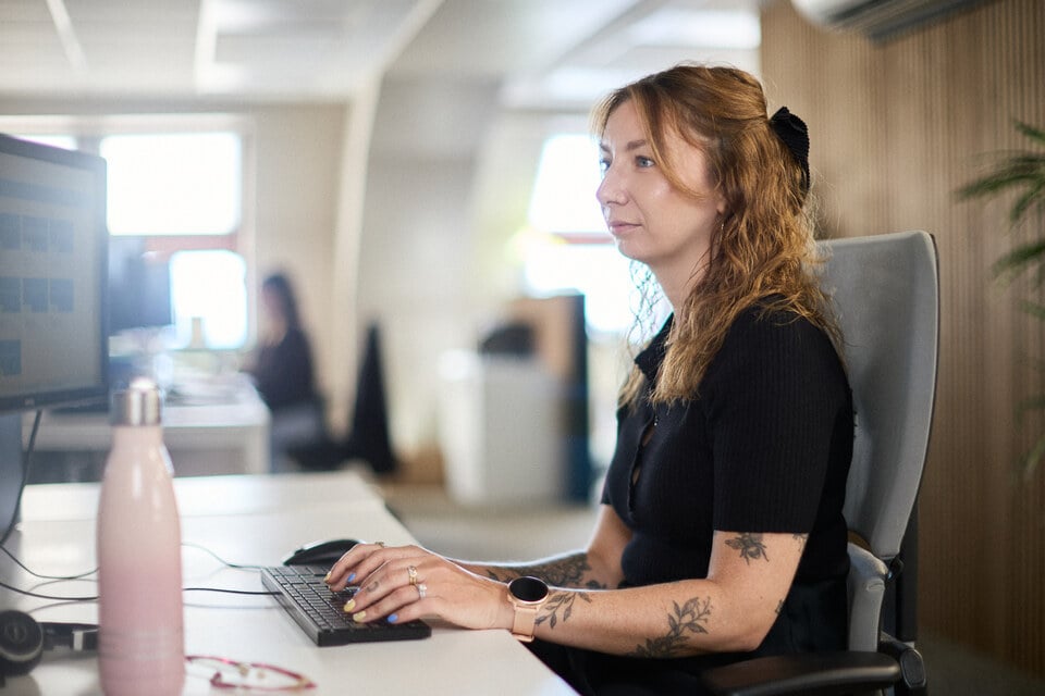 Becca Johns-Ogier at work in the Oracle Finance office